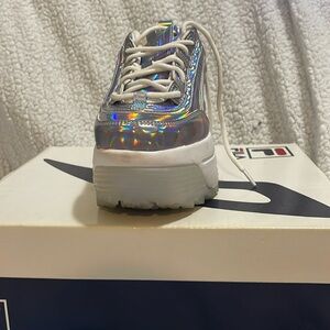 Metallic sneakers by Fila platform sole size 6 women’s. Worn maybe three times.